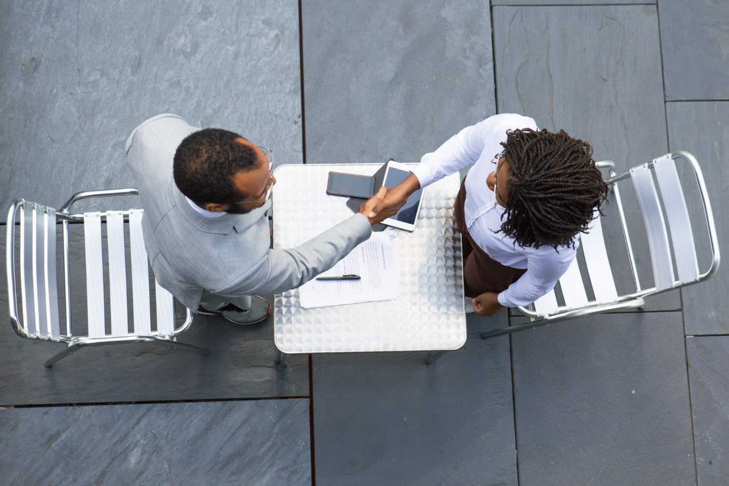 Bird-eye view of professionals shaking hands