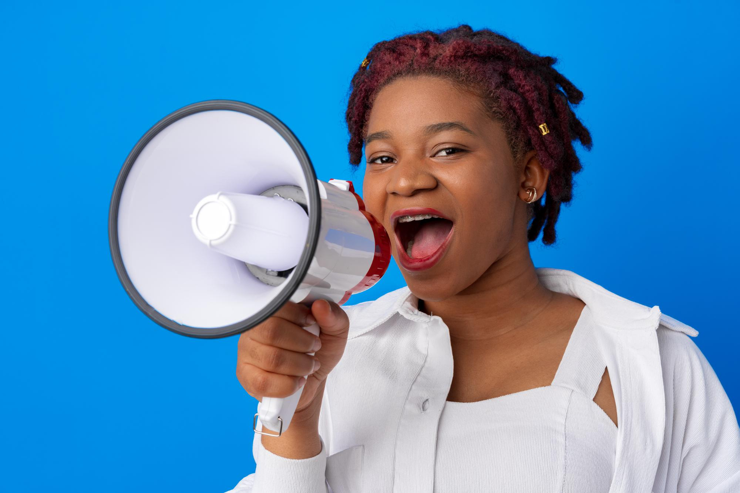 Woman with a megaphone providing news and updates